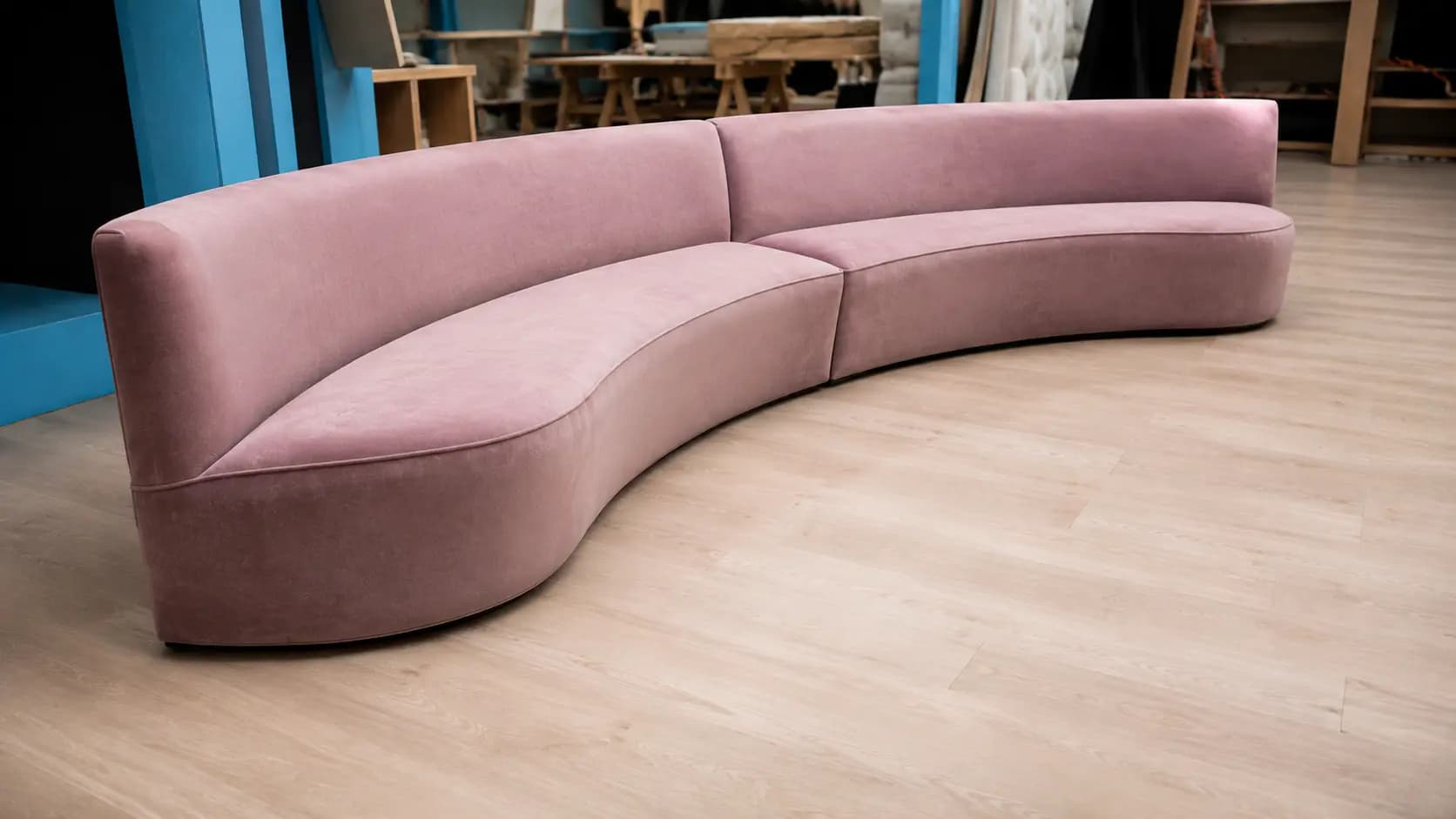 Craftsman handcrafting bespoke sofa in the Sofa N More London workshop